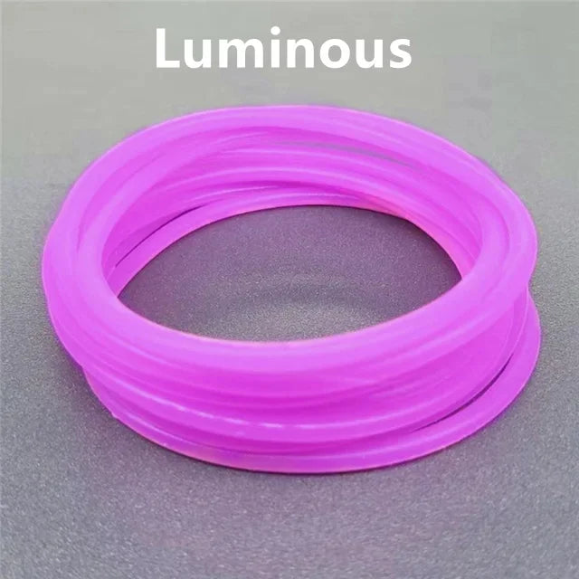 A roll of luminous pink silicone glow-in-the-dark bracelets