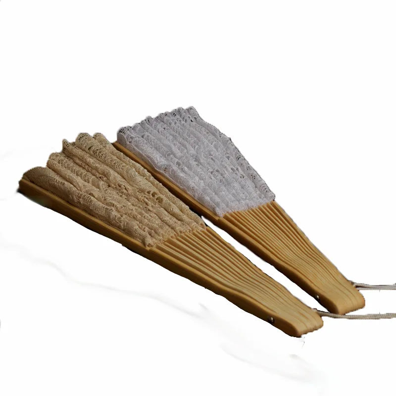 A wooden hand fan with a textured lace folding fan attached.