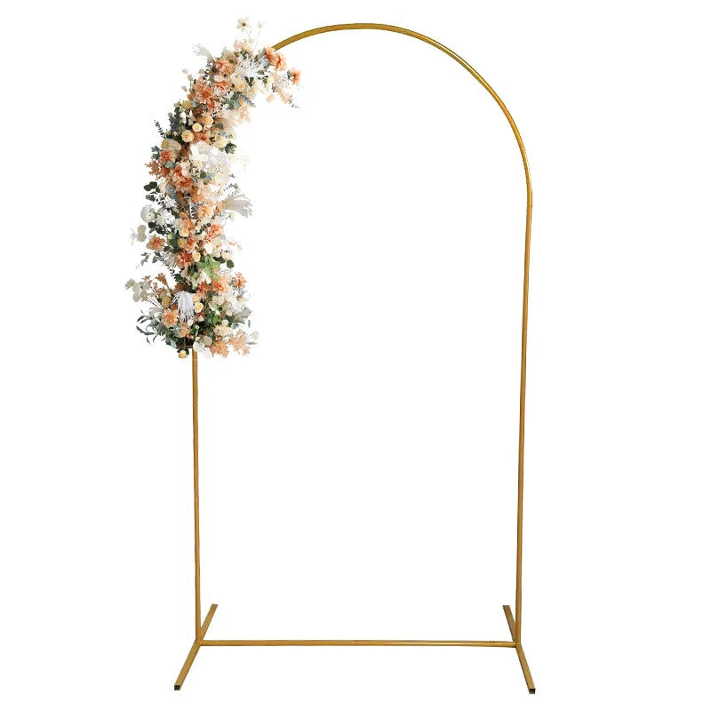 Elegant gold metal wedding arch stand with a floral backdrop frame