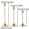 A set of three elegant gold-toned metal candle holders with varying heights and flared bases.