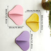 Three cherry-shaped wooden wall shelves in pink, yellow, and purple displayed against a white background.
