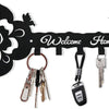 Black decorative metal wall-mounted key holder with seven hooks and a floral design