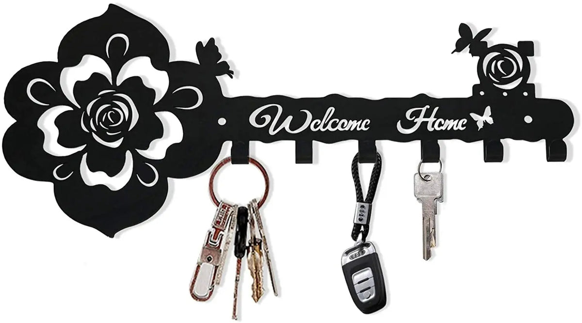 Black decorative metal wall-mounted key holder with seven hooks and a floral design