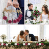 A close-up of hands holding a gold wreath with rose flowers and the text Happy Ever After