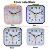 Four variations of a compact alarm clock showing pink, blue, black, and white colors with quartz movement.