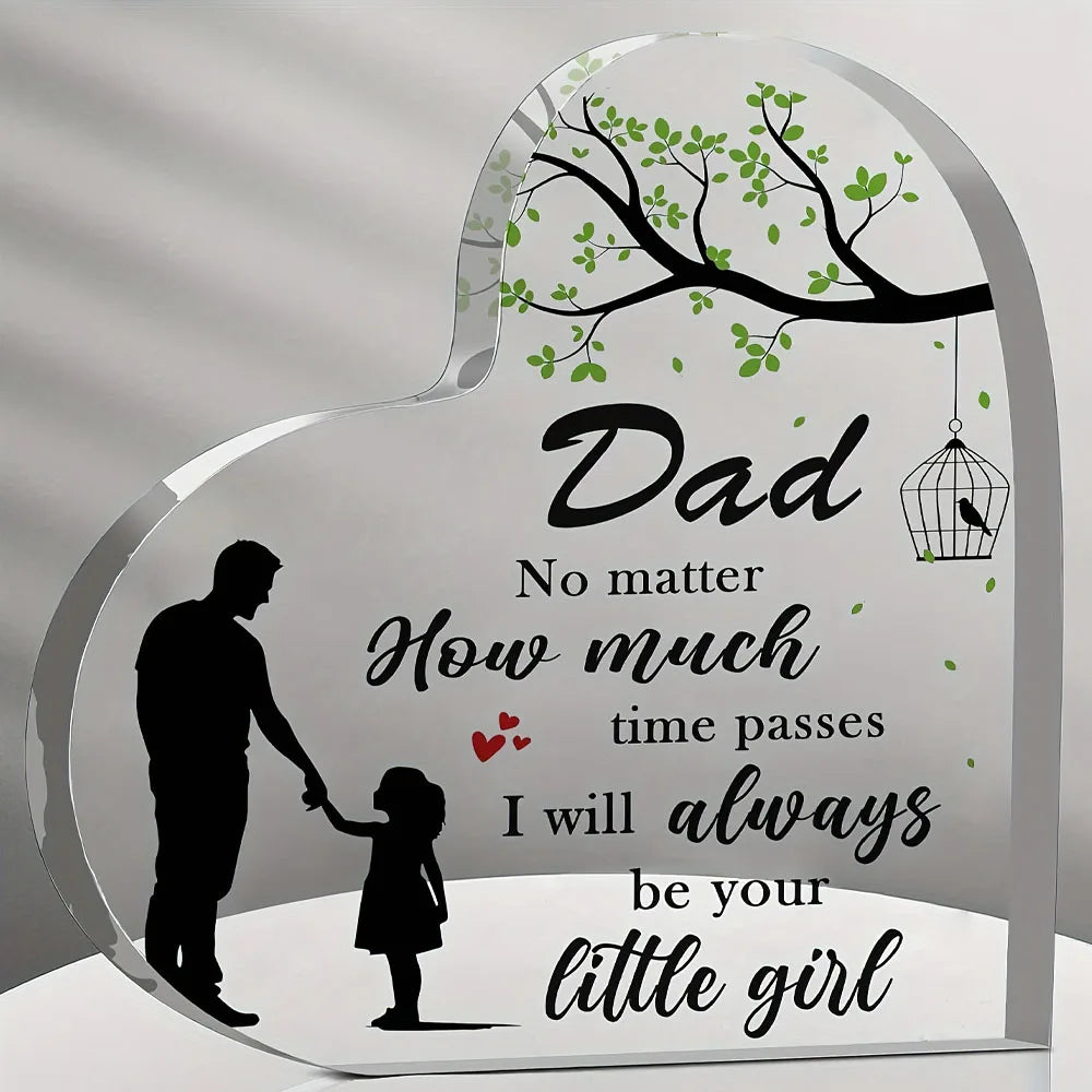 A clear acrylic heart-shaped plaque featuring a silhouette of a father and daughter with text that reads I will always be you