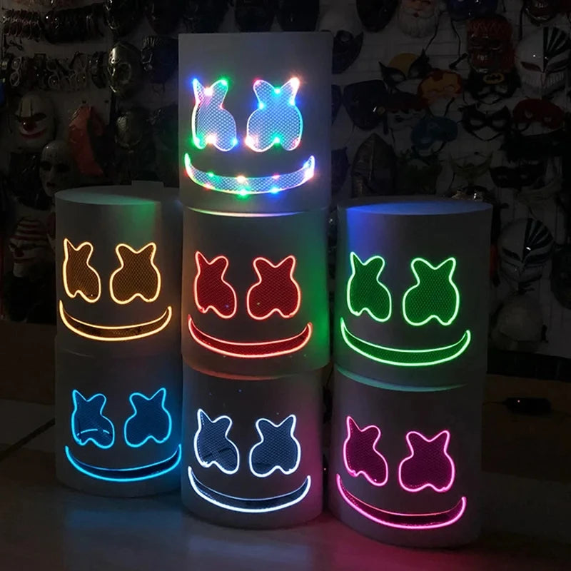 A set of four glowing neon LED party masks featuring various flashing light modes and smiling facial expressions.