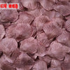 Pile of realistic silk rose petals in a dusty mauve color for weddings and events