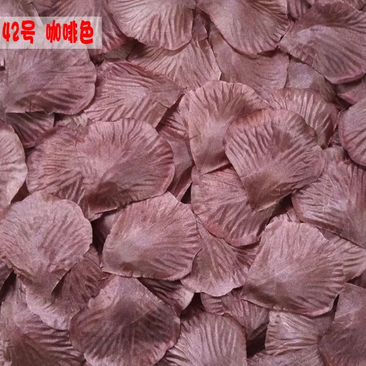 Pile of realistic silk rose petals in a dusty mauve color for weddings and events