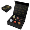 A black gift box containing a natural stone zodiac bracelet and various gemstone pieces for Leo.
