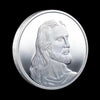 A silver commemorative metal coin featuring a profile portrait of Jesus Christ.