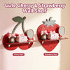 A decorative wall shelf featuring cherry and strawberry shapes with mirrors and pink accents for home decor
