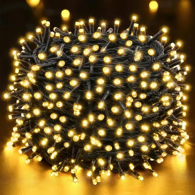 A spherical bundle of warm yellow LED string lights with bright bulbs, used for outdoor decoration.