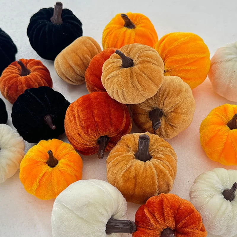 A set of five foam pumpkins in various colors including black, orange, yellow, and white for Halloween decor.