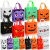 A collection of Halloween party treat bags featuring various pumpkin and ghost designs in black, purple, green, orange, and w