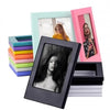 A set of five decorative photo frame magnets in various pastel colors, including pink, mint green, and purple.