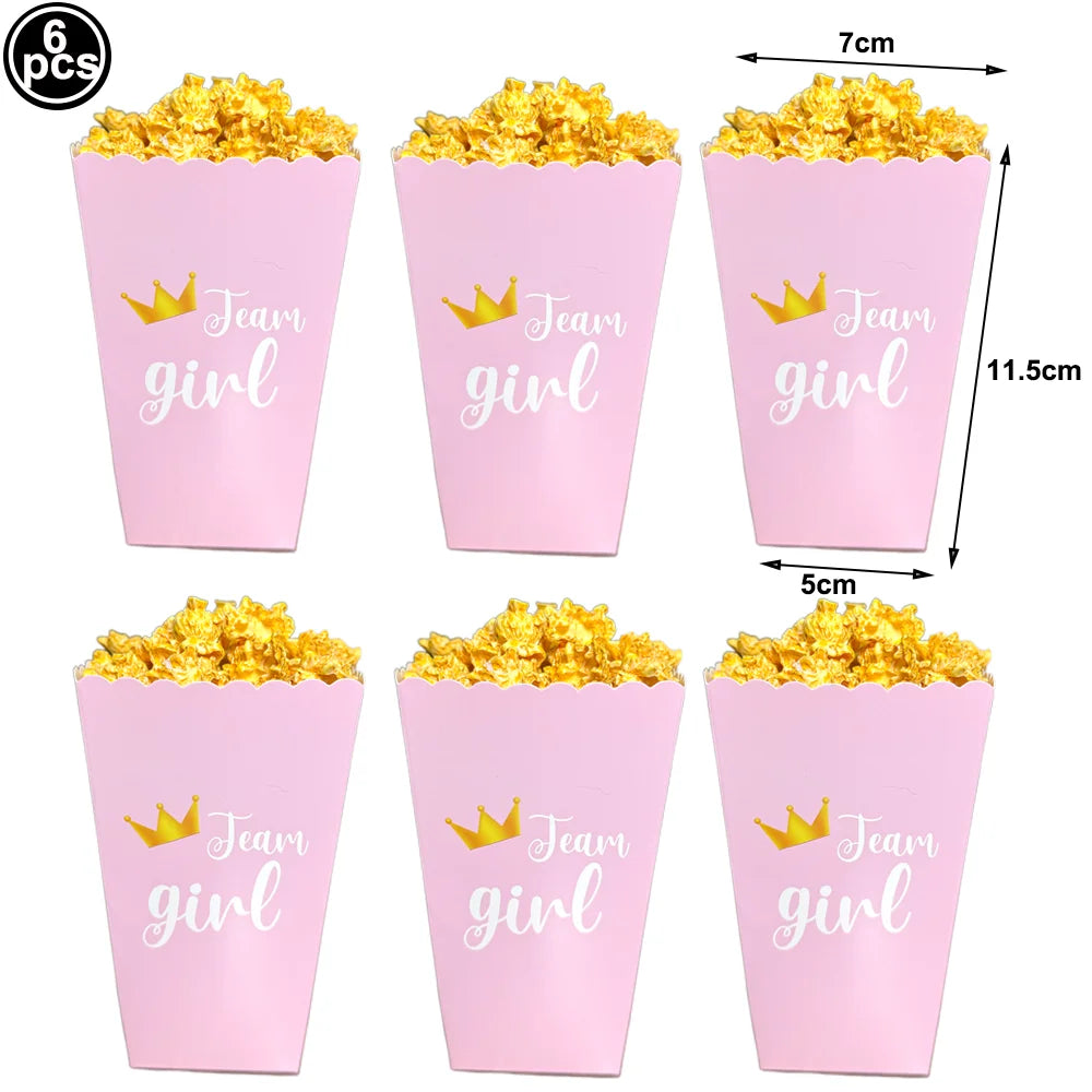 Six pink foil cups filled with gold confetti for baby shower decor
