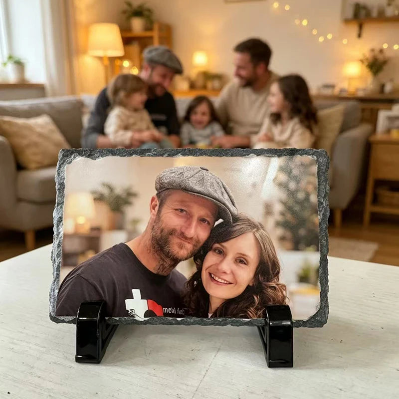 A personalized rectangular slate photo frame displaying a man and woman in a cozy indoor setting.