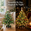 A beautiful Christmas tree decorated with crystal beads, shown in daytime and nighttime glow settings.