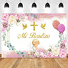 A pink and gold floral backdrop featuring a cross and balloons for a baptism or communion celebration.