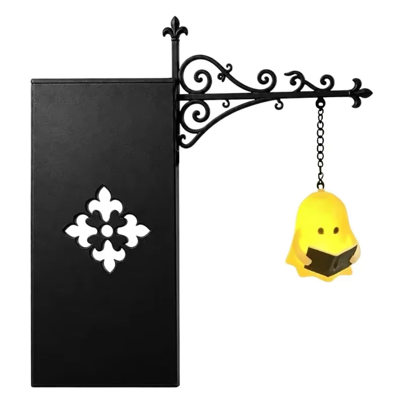 A black mini bookcase night light featuring a decorative wrought iron bracket and a warm yellow lantern glow.