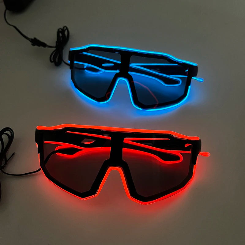 Pair of light up EL wire party glasses, one blue and one red, displayed on a white surface.