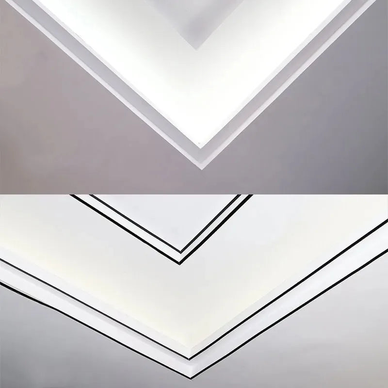 A close-up view of white self-adhesive PVC wall trim tape installed in a chevron pattern on a gray wall.