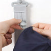A hand is shown adjusting a multilayer hat organizer rack for closet storage.