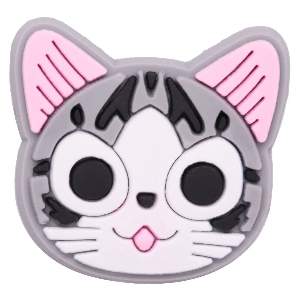 A set of 12 cartoon cat-like silicone shoe charms featuring pink and gray colors.