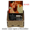 A hand-cranked wooden music box featuring a couple and decorative wood grain.