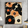 A framed canvas art print featuring a collage of black and orange vinyl records on a gray wall.