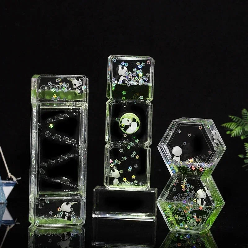 A clear glass hourglass filled with green liquid sand, featuring small white panda figures and mushrooms.
