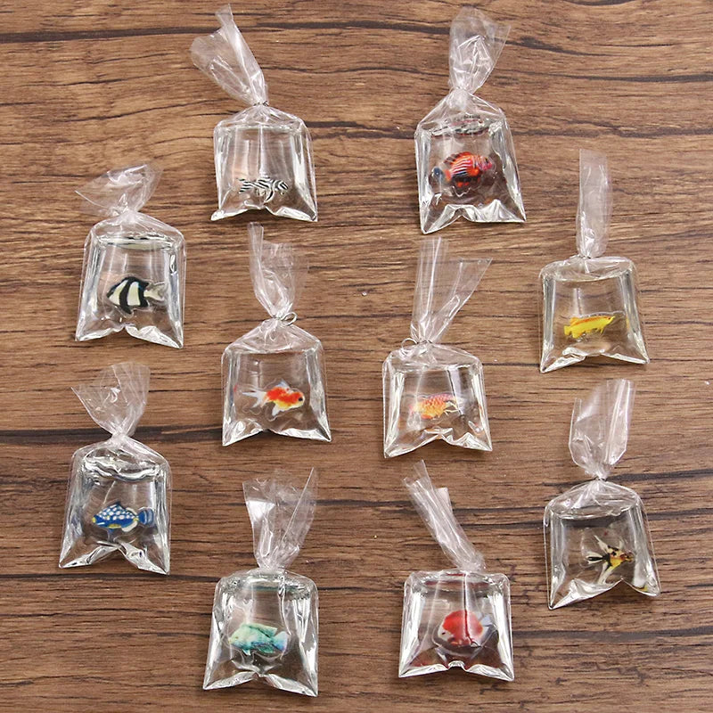 Colección de adornos de resina transparentes con forma de peces payaso en varios colores y formas para hacer joyería