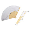 A white and natural bamboo folding hand fan shown in an open, pleated fan shape and a separate stick form.