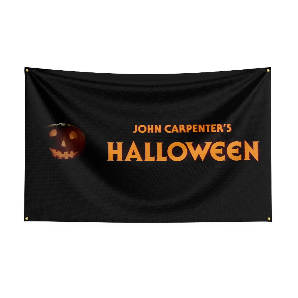 A black fabric flag with the text John Carpenter's Halloween in orange font and a small pumpkin graphic.