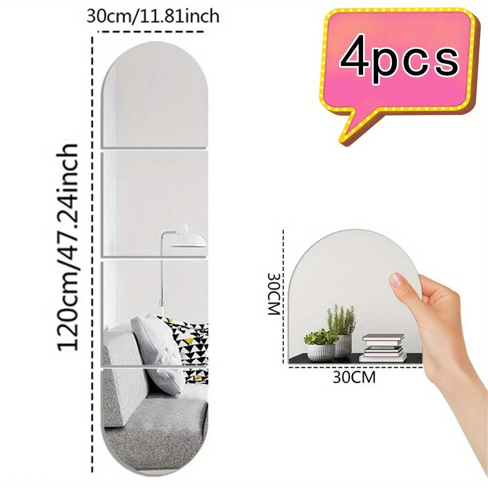 A set of four 30cm acrylic mirror wall decals shown in various sizes and a hand demonstrating the scale.