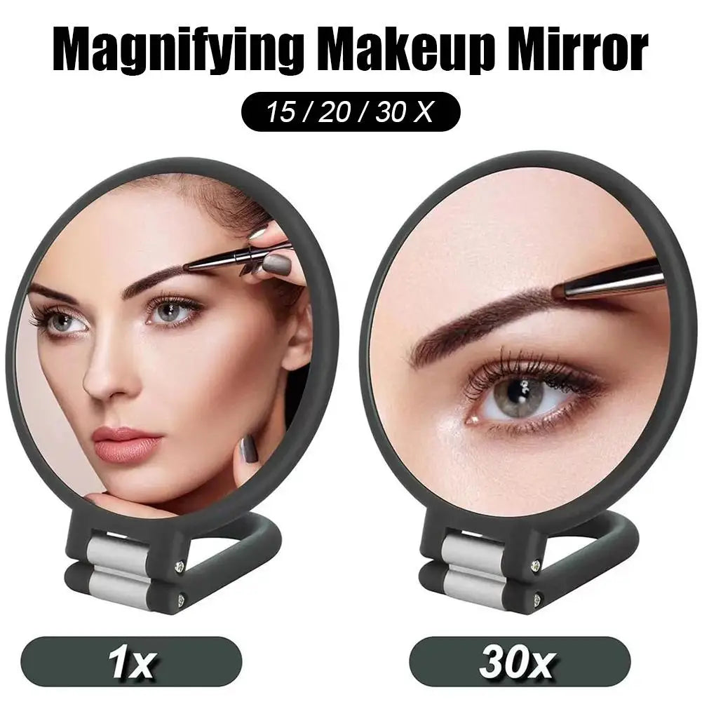 A handheld makeup mirror showing a close-up of an eye with magnification options 1x, 20x, and 30x.
