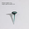 A small, teardrop-shaped glass flower with a long, slender stem, colored teal or aqua.