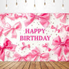 Pink satin bow ties and ribbons arranged as a birthday party backdrop banner