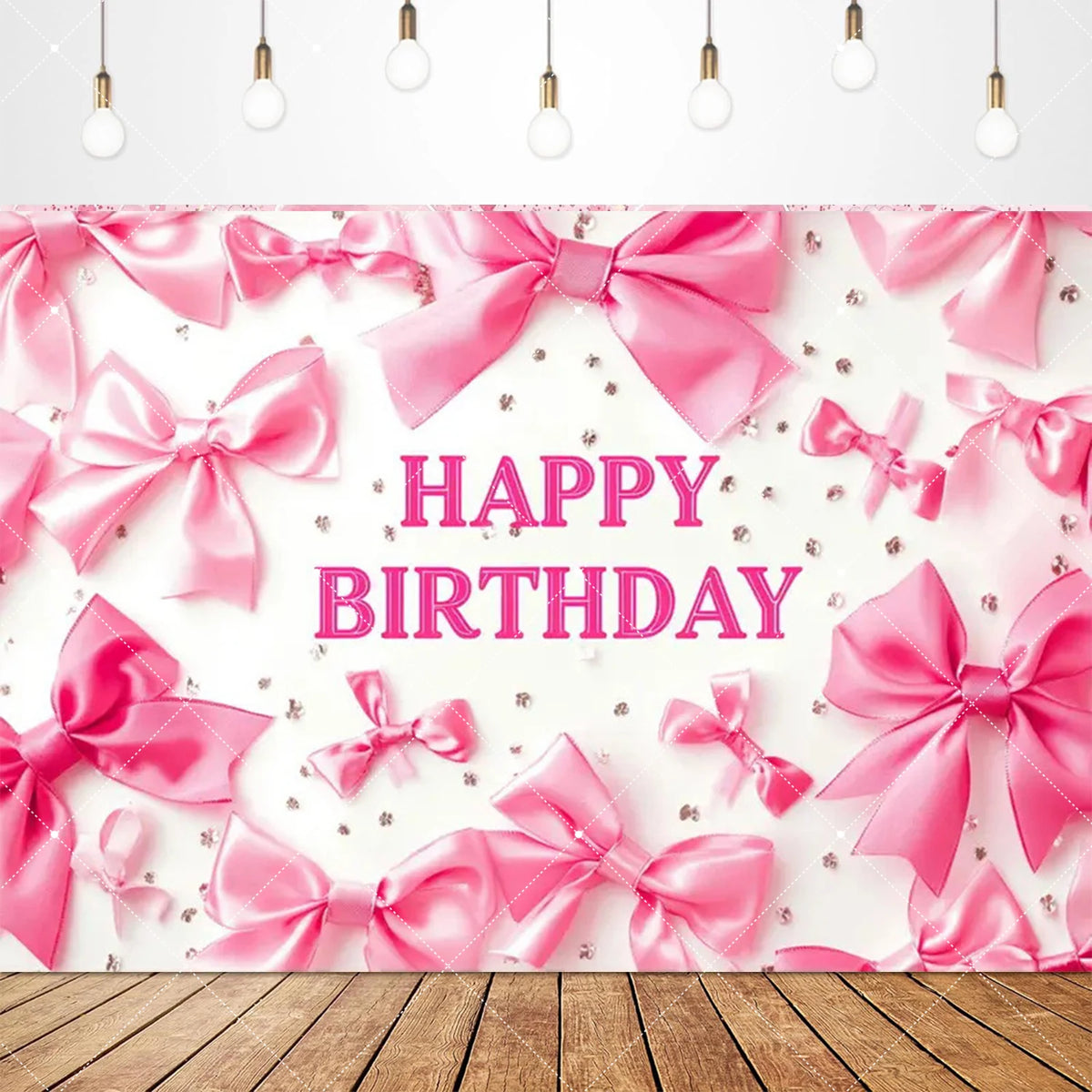 Pink satin bow ties and ribbons arranged as a birthday party backdrop banner