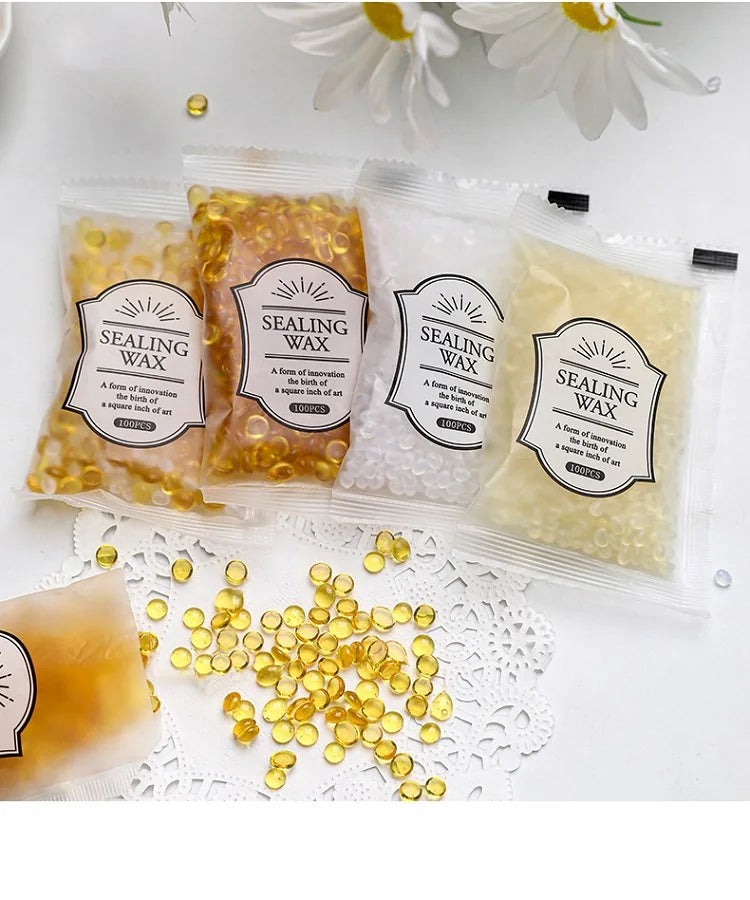 Packaged sealing wax beads in yellow and white colors for custom stamps
