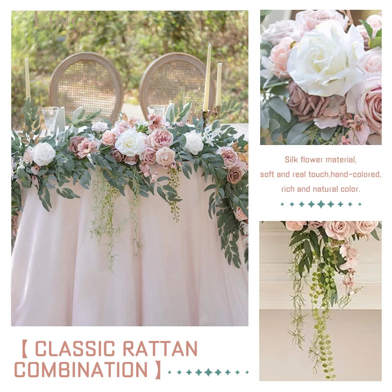 A floral arrangement featuring pink and white roses and green eucalyptus garlands displayed on a draped table.