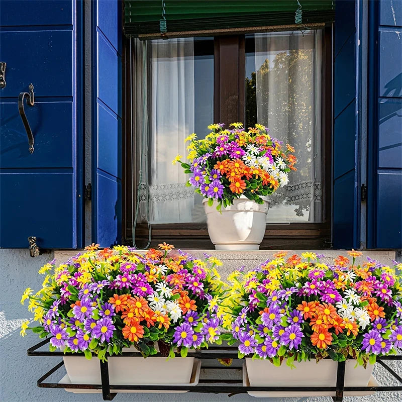 A vibrant bouquet of silk daisies in various colors is displayed on a black metal rack.
