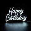 A glowing white LED neon sign spelling out Happy Birthday against a dark background.