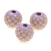 A set of natural wooden checkered beads used for jewelry making, featuring purple and tan stripes.