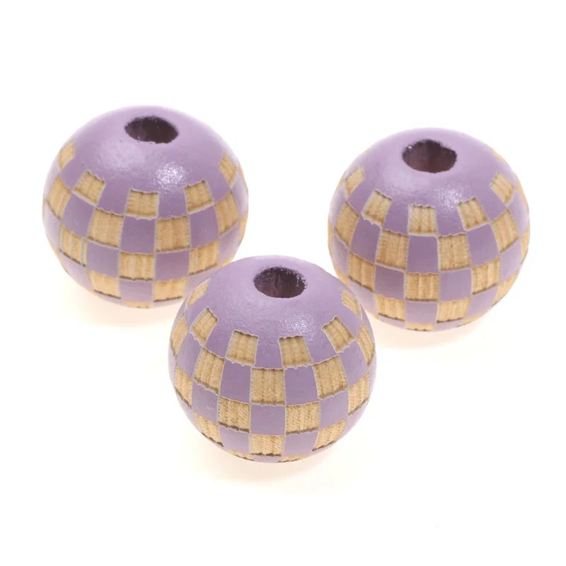 A set of natural wooden checkered beads used for jewelry making, featuring purple and tan stripes.