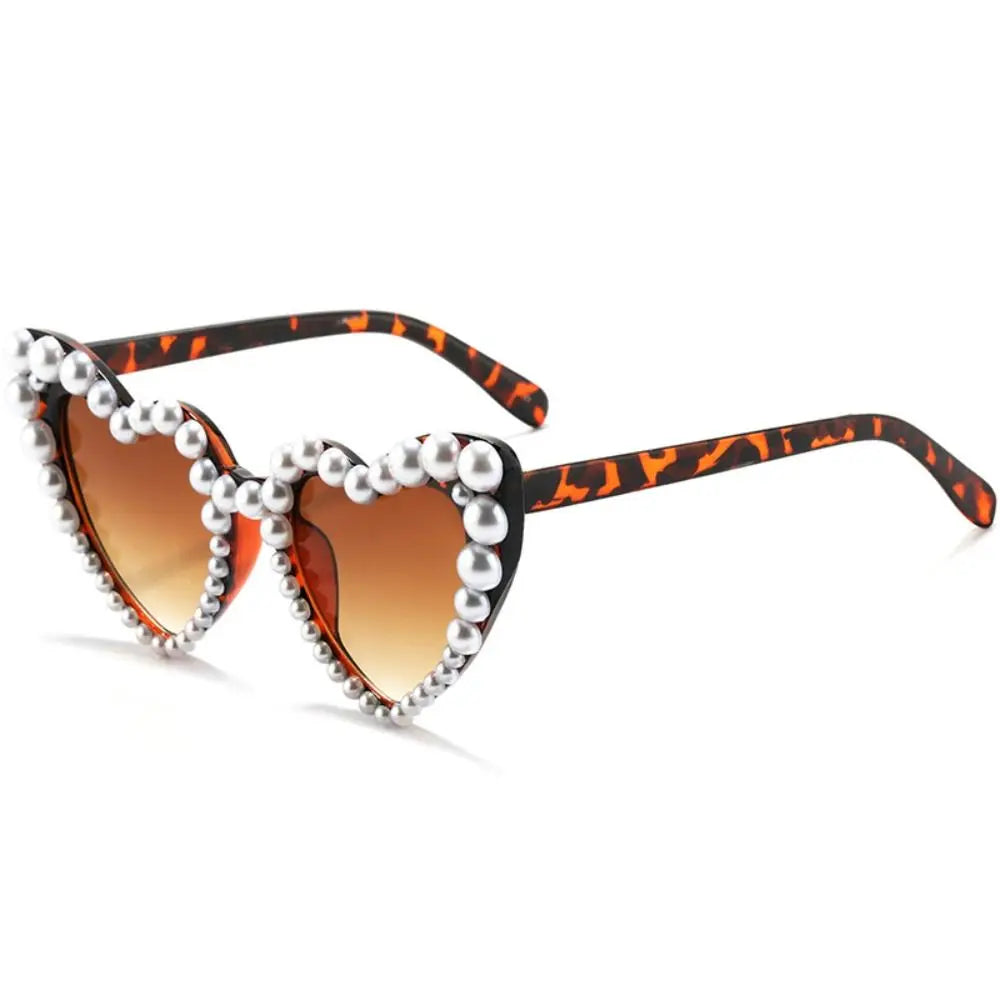 Orange leopard print heart-shaped sunglasses embellished with pearls