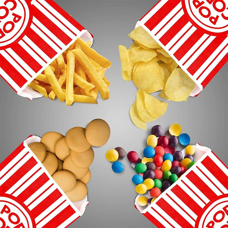Three open red and white striped paper bags filled with popcorn and colorful candies.