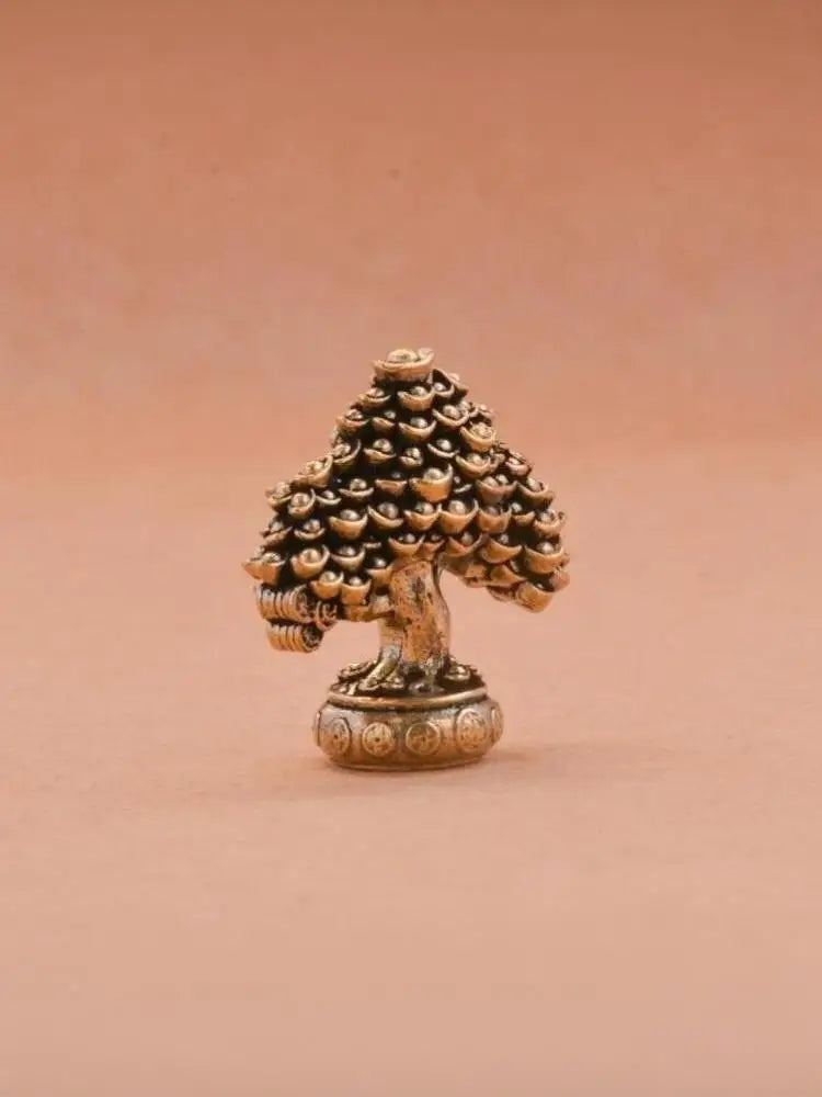 Brass fortune tree ornament featuring pinecone texture and ingot accents.