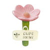 Pink flower shaped watering station with a bee tag for bees